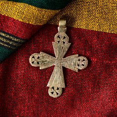 Handmade Ethiopian orthodox church neck cross made of bronze. Uniquely made cross pendent by seasoend Ethiopian artisian using lost wax method of jewelry making and hand engraved to give it a final touch.  The cross measures 75 x 55 mm.(HxW)  Please visit my shop for similar items and buy more and save more on shipping. Ethiopian neck cross orthodox church neck cross pendant African beads handmade Handmade Bohemian Cross Necklace, Bohemian Handmade Cross Necklace, Ethiopian Cross, Cross Pendent, Coptic Cross, Orthodox Church, African Beads, Beads Handmade, Final Touch