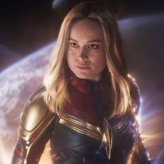 the avengers movie character is looking at the camera with an intense look on her face