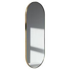 a mirror that is on the wall with a light coming in from it's side