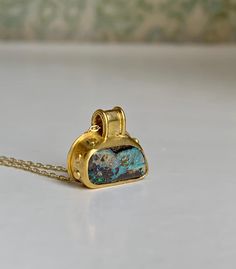 "Australian Boulder Opals in a unique 22k Gold ancient granulation setting.  This Opal is full of flashy color in matrix, photos and video taken in natural daylight so the multiple iridescent colors are shown true.  It's wrapped in an ancient stylized 22k Gold bezel with wide bail and granulation.  A unique addition to my \"Ancient Illusion\" Opal and 22k Gold pendant collection. A perfect size at 15mm wide and 17mm tall." 22k Gold Necklace, Weird Jewelry, Australian Boulder Opal, Cabochon Pendant, Brass Jewelry, Jewelry Inspo, Boulder Opal, Opal Jewelry, 22k Gold