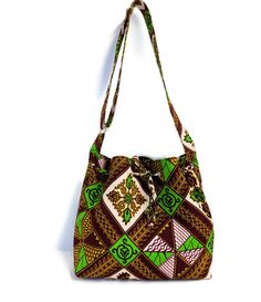 This beautiful 100% cotton African Print Bag is handmade with 100% cotton fabric, lining, and fusible fleece to give it a bit of a sturdy body. This bag can be used as a crossbody bag for women and also for teenagers to take to school. The size is perfect to use daily. All my bags and skirts are made in my pet-free and smoke-free home in Oxford Mississippi. MEASUREMENT: 12'' wide x 11.5'' height x 4 '' deep (gusset). FEATURES: *It has 2 slide pockets and 1 zipped pocket inside. *Closes with a dr Green Bucket Shoulder Bag For Gift, Green Bucket Shoulder Bag Gift, Green Rectangular Bucket Bag For Gifts, Green Rectangular Bucket Bag As Gift, Rectangular Green Bucket Bag As A Gift, Brown Rectangular Cotton Hobo Bag, Rectangular Brown Cotton Hobo Bag, Square Cotton Shoulder Bag For School, Cotton Square Shoulder Bag For School