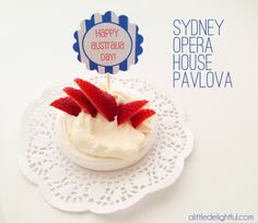 a cupcake with strawberries on top and happy australia day sign in the background