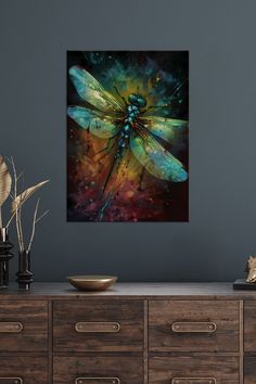 a dragonfly painting on a wall above a dresser