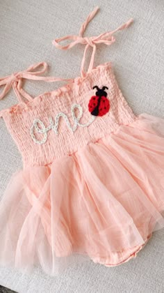 Beautiful one romper for your little lady bug babe. This listing is for a pink romper, one lettering in off white and a lady bug appliqué next to it.  Birthday photoshoots, special events, etc. If you'd like a different color or saying, don't hesitate to contact us One Cute Bug Birthday Theme, Babies First Birthday Theme, Love Bug Birthday Theme, Bug First Birthday Party