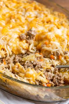 a casserole dish filled with meat and cheese