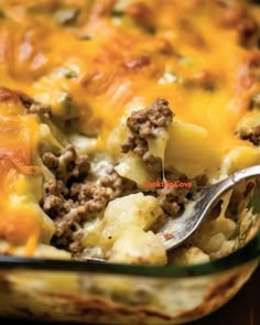 a casserole dish with meat and cheese in it is ready to be eaten