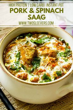 a white bowl filled with meat and spinach soup