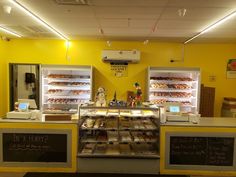 a bakery with lots of donuts and pastries on display