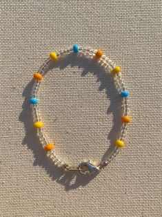 a beaded bracelet with yellow and blue beads