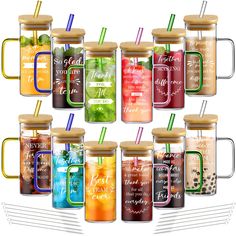 a set of twelve mason jars with lids and straws, each filled with different types of drinks