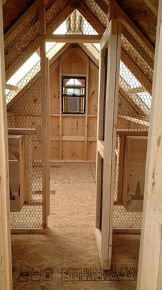 the inside of a building with wooden walls and flooring in place to make it look like something out of a fairy tale