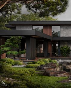 a modern house surrounded by trees and rocks