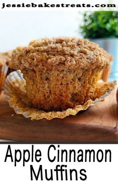 apple cinnamon muffins on a cutting board with the title overlay reads, apple cinnamon muffins