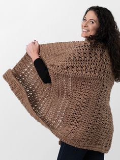 a woman wearing a brown knitted shawl