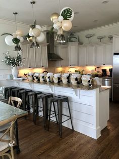 a kitchen filled with lots of counter top space next to a refrigerator freezer and oven