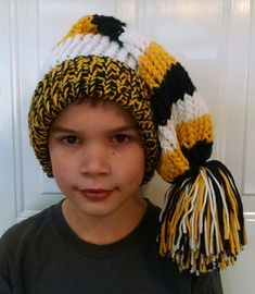 This particular hat fits child to adult.  It can be made any color and with or without stripes.  This is a great gift for a student or sports' fan.  Let me know if you have a question or request.  If you are ordering more than one, please contact me, as it may take a little longer to receive your order. Colors may vary slightly. Pittsburgh Steelers Hats, Crochet Ruffle, Stocking Hat, Hat Fits, A Student, Pittsburgh Steelers, Team Colors, Yellow Black, Red Yellow