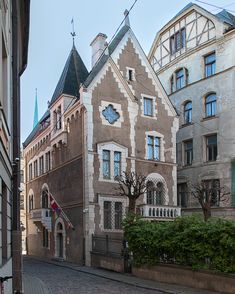 an old building with a clock on the front