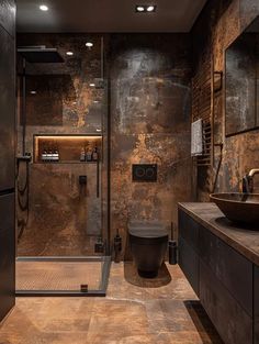 a bathroom with a toilet, sink and shower stall in the middle of the room