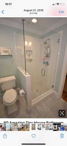 a white toilet sitting next to a shower in a bathroom on top of a tiled floor