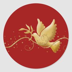 a golden dove with three lit candles on a red round sticker that says merry christmas