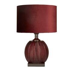 a table lamp with a red shade on it