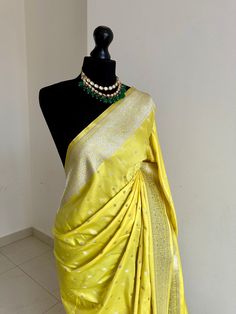 Classic and timeless Banarasi silk saree in yellow. Vibrant yellow silk saree with plain contrast blouse with border for sleeve cuffs. Rich gold zari. Perfect statement saree that's bang on trend for wedding and events. Koorai style saree for all traditional events. Rich pallu with zari and tassels, available in other colours. Blouse: plain running material with border for cuffs, unstitched Yellow Pre-draped Saree For Festivals, Yellow Silk Pre-draped Saree With Pallu, Elegant Yellow Pre-draped Saree With Traditional Drape, Yellow Katan Silk Pre-draped Saree, Festive Yellow Paithani Silk Pre-draped Saree, Yellow Pre-draped Saree With Cutdana, Elegant Yellow Pre-draped Saree With Zari Weaving, Festive Yellow Saree Blouse Piece, Festive Yellow Blouse Piece For Saree