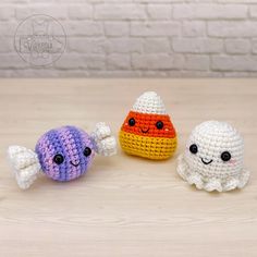 three small crocheted toys sitting next to each other