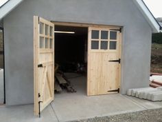 an open garage door on the side of a building that has been built into it