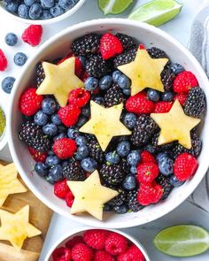 berries, raspberries and limes are arranged in bowls with stars on them