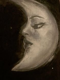 a black and white drawing of a woman's face next to a half moon