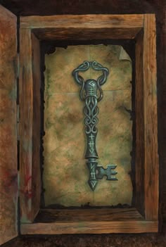 a painting of a key in a wooden frame