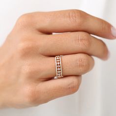 a woman's hand with a ring on it