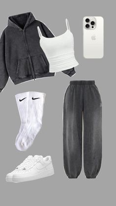 a white phone and two pairs of grey sweatpants, one pair of black nike sneakers