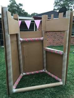 an open cardboard box sitting on top of grass