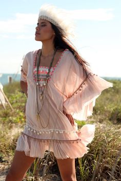 This is a fun & romantic tunic! This super soft boho chic tribal inspired cotton tunic dress / cover-up has embroidery and pom-poms details on the Flowy V-neck Boho Dress For Festivals, V-neck Dress With Back Tassel Tie-up For Summer, Bohemian V-neck Kaftan For Spring, Spring Beach Cover-up Dress With Tassels, Bohemian V-neck Boho Dress For Festivals, Pink V-neck Bohemian Dress, Festival V-neck Boho Dress With Boho Print, Festival Boho Dress With V-neck Boho Print, Festival V-neck Boho Dress