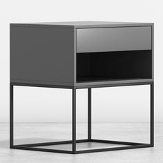 a black and grey side table with one drawer open