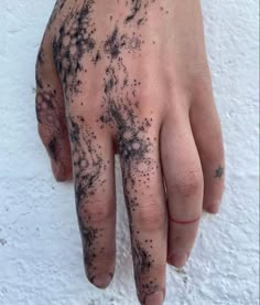 a person's hand with black ink on it