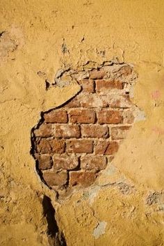 a brick wall with a hole in it