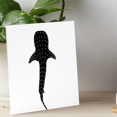 a black and white drawing of a shark with dots on it's body art board print