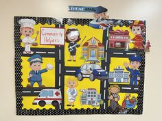 a child's bulletin board with pictures of people and vehicles on it in the classroom