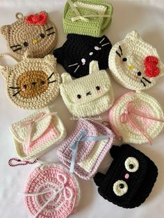 several crocheted items are arranged in the shape of kittens and other animals