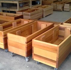 several wooden drawers on wheels in a warehouse