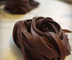 a close up of a chocolate pastry on a table