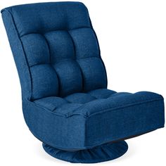 an upholstered blue chair on a white background