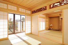 an empty room with sliding glass doors and white walls