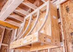 the inside of a house being built with wooden framing and plywood boards on the ceiling