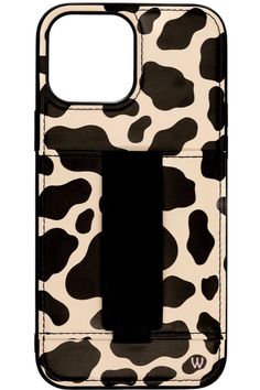 a cell phone case with a black and white cow print on the front, featuring an attached