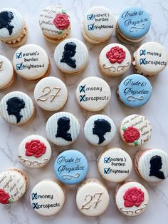 many decorated cookies are arranged on a marble counter top with the names of different women and men