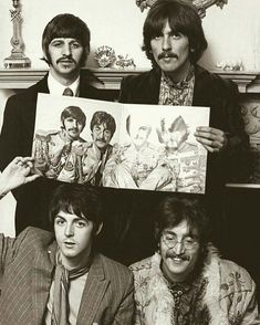 the beatles are posing for a photo in front of a fireplace with pictures on it