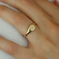 Everyone needs a signet ring in their jewelry box. This simple, chic signet ring is 14k yellow gold. Each ring has a hand engraved initial on it. Initials A-Z are available. Signet rings are classic and won't go out of style, this ring is under $500! 14k yellow gold Hand engraved Initials A-z available Please allow 4-6 weeks for production. Timeless Open Initial Ring For Promise, Formal White Gold Open Initial Ring, Luxury Round Signet Ring For Promises, Luxury 14k Stamped Signet Ring With Round Band, Wedding 14k Gold Signet Ring With Round Cut, Elegant 14k Gold Engraved Initials Ring, Yellow Gold Signet Ring For Anniversary, Yellow Gold Open Initial Ring For Formal Occasions, Personalized Classic Diamond Promise Ring